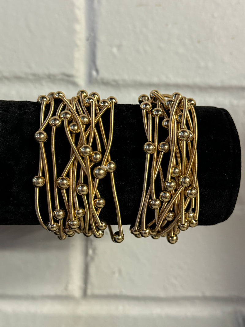 Gold Coil Bracelet with gold beads